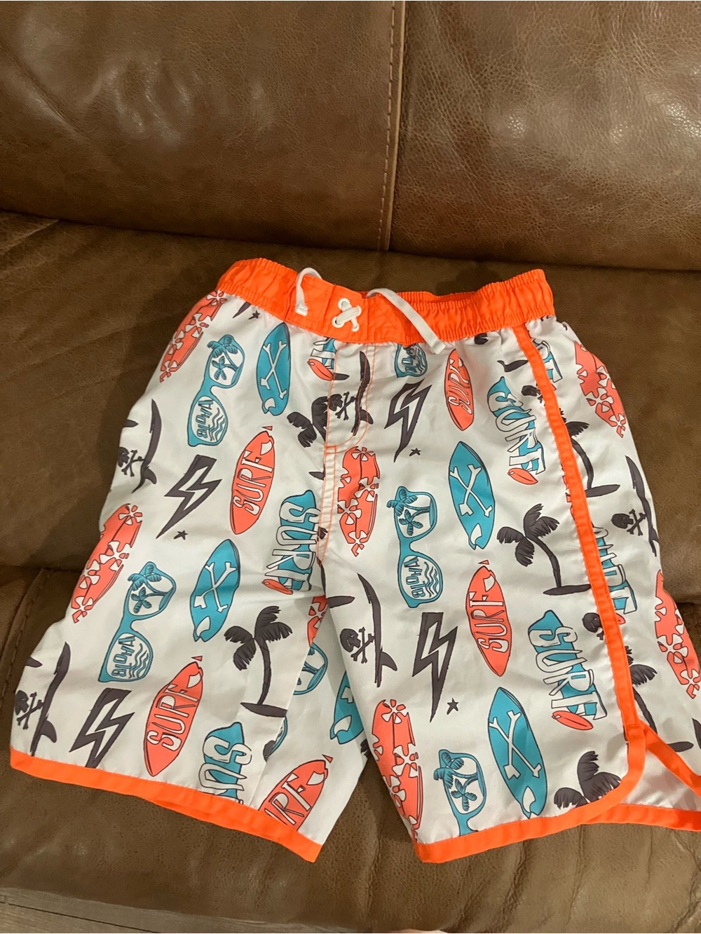 White Surf Print Boys Swim Shorts with Orange Trim